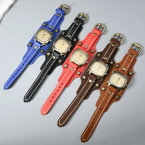 Macro view of vintage leather wristbands with rivets and visible stitching details