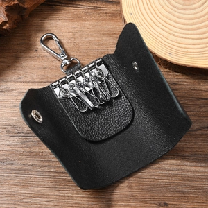 Vintage black leather key case with six metal hooks and a sturdy carabiner clip
