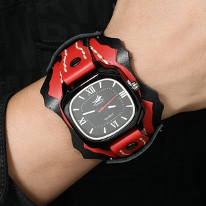 Detailed macro of men's punk leather watch with red stitching and metal rivet studs
