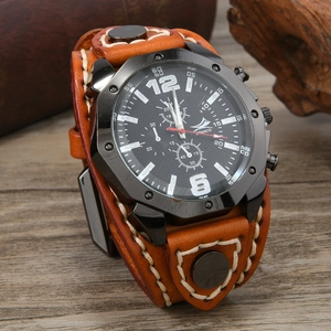 Detail of vintage brown leather punk watch with white stitching and black dial