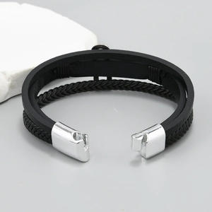 Macro shot of multi-layer braided leather bracelet with silver magnetic metal clasp