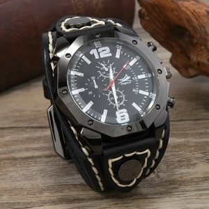 Detail of vintage punk wide leather watch strap with white stitching and metal rivets