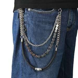 Multi-layer punk waist chain featuring silver bicycle link and black woven cord on jeans