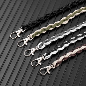 Detail of five multi-colored braided wax cord pant chains with silver lobster clasps
