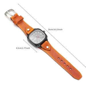 Vintage square quartz watch with brown leather strap and silver studs on white background