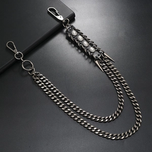 Multi-layer gunmetal chain belt with leather rivets and metallic cone charms