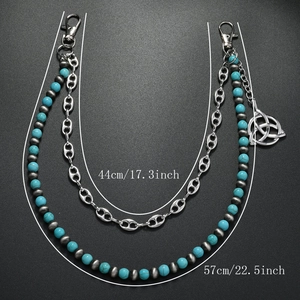 Double-layered turquoise beaded pants chain with a Celtic knot pendant and lobster clasp
