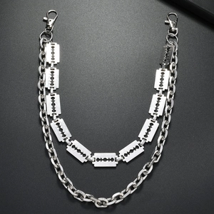 Close-up of double-layered silver punk pants chain featuring razor blade pendants