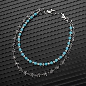 Detail of double-layer turquoise bead waist chain with silver stars and lobster clasps