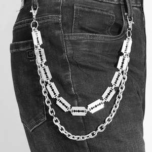 Close-up of a double-layered punk pants chain with metallic razor blade shaped pendants