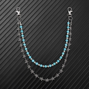 Detail of turquoise beads and silver star chain layers with lobster clasps