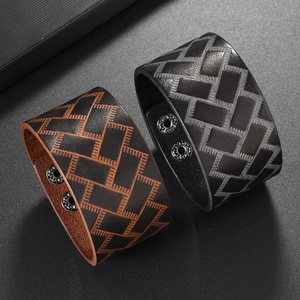 Retro wide leather bracelets with geometric woven patterns and silver snap buttons