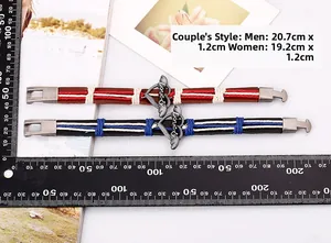 Detailed view of couple's leather bracelets with LOVE heart buckle and size measurements