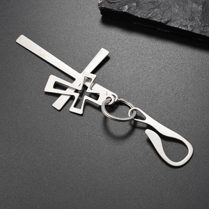 Detail of silver alloy double cross keychain with metallic ring and secure hook