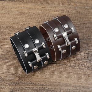 Punk style wide leather bracelets in black and brown with silver H-buckle and metal studs