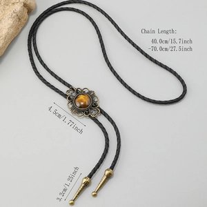 Cravate bolo vintage avec pendentif floral gravé et oeil de tigre sur cordon tressé