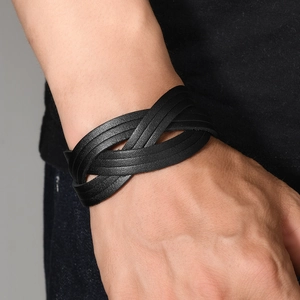Handmade woven black leather bracelet for men featuring a modern infinity knot design
