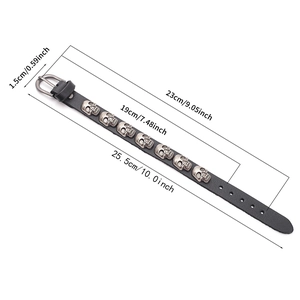 Punk black leather wristband with silver skulls featuring adjustable buckle and dimensions