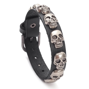 Punk style black leather skull bracelet with vintage silver charms and buckle