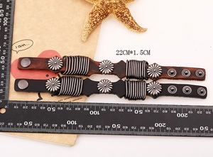 Detail view of vintage punk leather bracelet with metal buckles and 22cm length scale