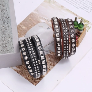Men's punk leather wrap bracelet featuring silver metal rivets in black and dark brown