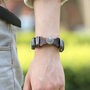 Vintage brown leather punk rock bracelet with daisy metal charm and silver wire wrap detail
