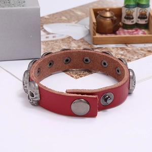 Red leather punk bracelet with silver metal skull studs and adjustable snap button