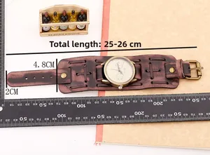 Macro shot of vintage red-brown leather watch band with weave detail and brass studs