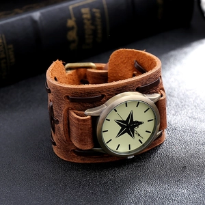 Close-up of vintage punk brown leather watch with woven rope detail and star dial design