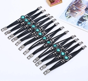 Detail of 12 zodiac signs leather bracelets with glowing charms on white background