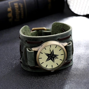 Detail of vintage military-style leather wristband watch with brass case and star dial