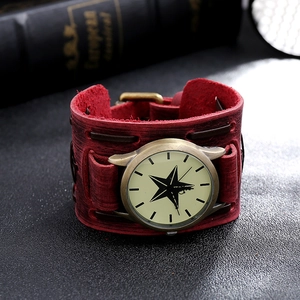 Macro shot of punk style wide leather watch band with bronze star dial and woven details