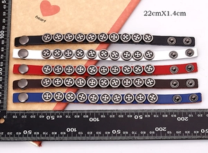 Detailed set of five leather bracelets with metal Maltese cross rivets and snap closures