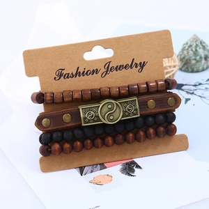 Set of 4 vintage leather and wood bead bracelets with bronze Bagua charm detail