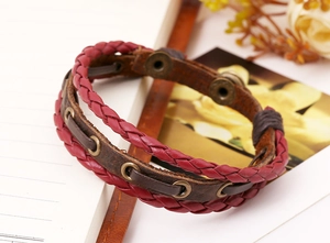 Close-up of vintage multi-layer braided leather bracelet with retro metal snaps