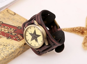 Detailed close-up of retro leather watch featuring bronze case and star pattern dial