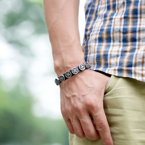 Men's punk leather bracelet featuring vintage metal cross studs on a wide black band