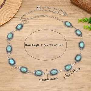 Bohemian silver metal waist chain belt with oval turquoise stones on a rustic background