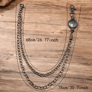 Retro multi-layer silver hip-hop trouser chain with Tree of Life charm on wood background