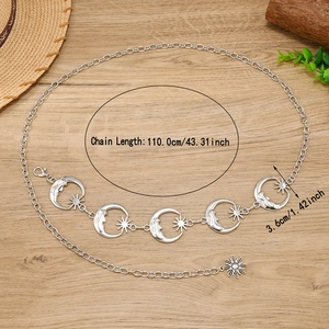 Silver celestial waist chain with moon and sun charms for women on wooden background