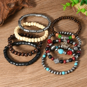 Detail of 8pcs bohemian wooden bead bracelets with a vintage butterfly charm pendant