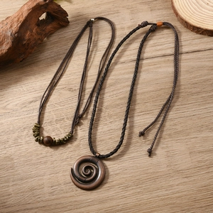 Bohemian leather cord necklaces featuring vintage spiral pendant and bronze beads