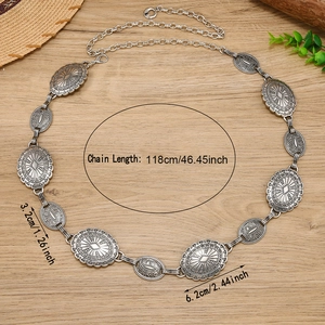 Bohemian silver metal chain belt with engraved oval charms on a natural wood background