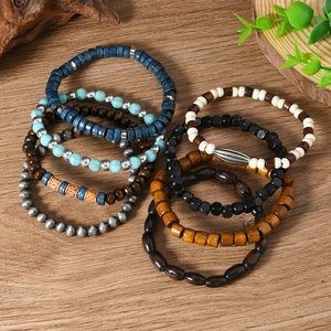 Detail of 8-piece bohemian multilayer wood bead bracelets in blue and earthy tones