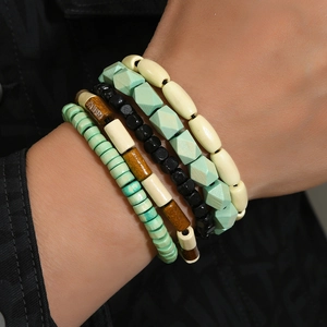 Bohemian 4-piece stacked wooden bead bracelet set with mint green and cream accents
