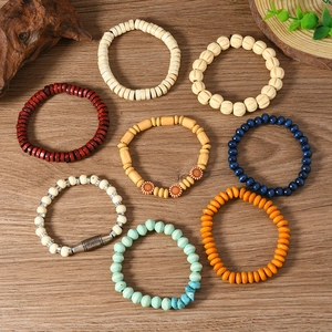 Detail of 8-piece multilayer beaded bracelet set with wood, ceramic and ethnic patterns