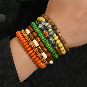 Bohemian multilayer wood bead bracelet set with vibrant colors and carved silver metal beads