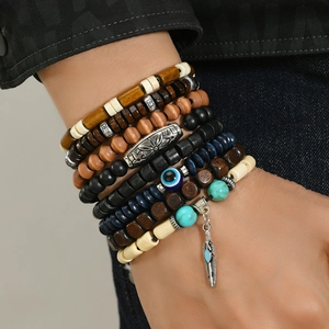 Bohemian multi-layer wooden bead bracelet set with retro feather charms on model wrist