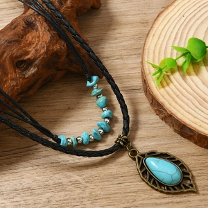Bohemian leaf pendant necklace with turquoise beads on vintage leather cord and wood decor