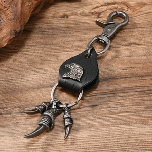 Detail of vintage punk leather keychain featuring eagle head relief and three eagle claws